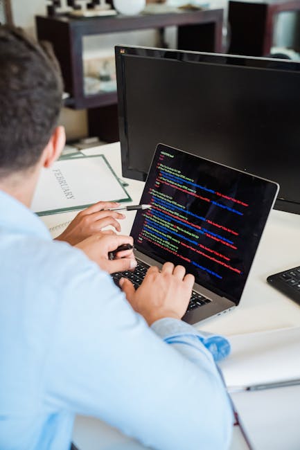 A computer screen displaying lines of HTML code with colorful syntax highlighting in shades of blue, yellow, red, and white. The code includes tags, attributes, and links to image files, set against a